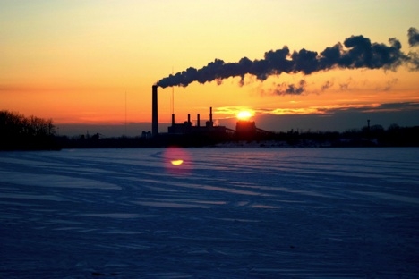 A coal-fired electricity generation plant at sunset
